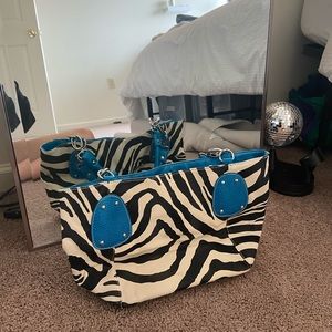 Zebra bag. Super cute w/ pop of blue is amazing.